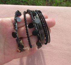 This is a lot of black thin metal bangle bracelets.  There are 9 in the lot.  Some have scratches and minor flaking.  They vary in sizes from 2 1/2" in diameter to 2 3/4" in diameter. Black Bangle, Simple Living, Bangle Bracelets, Jewelry Bracelets, Bangles, Quick Saves, Black, Jewellery Bracelets