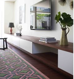 a living room with a large mirror on the wall