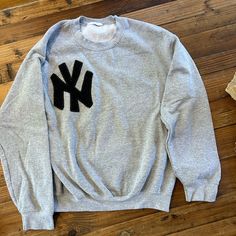 Nwot, Never Worn, Crew Neck Sweatshirt With Embroidered Felt Ny Emblem. Slightly Oversized Size Small, Hits At Hips. Greys Anatomy Crewneck, Grey Sweatshirt Embroidery, Gray Sweater With Embroidered Logo For Streetwear, Gray Embroidered Logo Top For Streetwear, Gray Tops With Embroidered Logo For Streetwear, Oversized Sweater With Embroidered Logo, Gray Relaxed Fit Tops With Embroidered Logo, Oversized Long Sleeve Sweater With Letter Embroidery, Oversized Sweater With Letter Embroidery