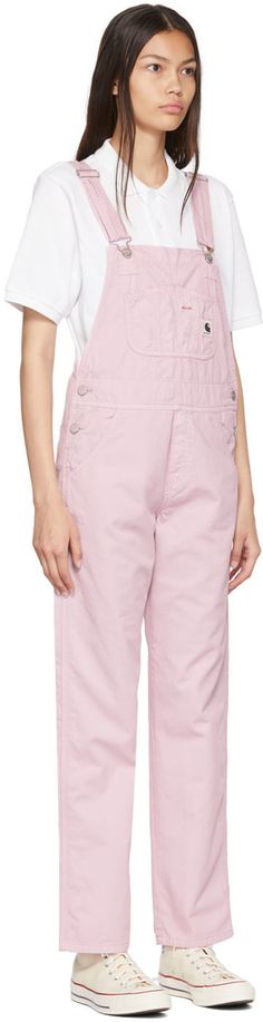 Cotton twill overalls. · Adjustable shoulder straps · Patch pockets and logo patch at chest · Four-pocket styling · Mock-fly · Button closure at outseams · Logo-engraved silver-tone hardware Supplier color: Pale quartz Pink Carhartt Overalls, Pastel Overalls, Overalls Cute, Pink Carhartt, Pink Overalls, Carhartt Overalls, Cotton Overalls, Fashion Merchandising, Carhartt Work In Progress