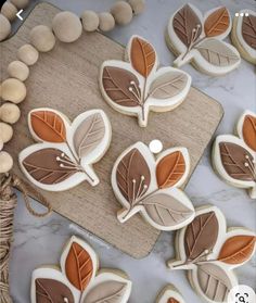 cookies decorated with leaf shapes on a table