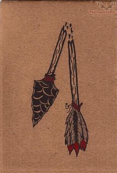 two arrows with feathers on them are attached to a piece of brown paper that has red and black ink