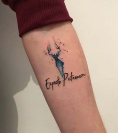 a woman's arm with a tattoo on it that says explore patamon