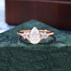 an engagement ring with three pear shaped diamonds