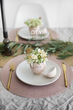 a white plate topped with flowers on top of a table