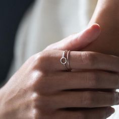 The Diamond Dusted Karma Ring is an understated reminder that you get what you give.A union of simplicity and meaning, the circle on the ring features our signature diamond dusted texture.details+ ring band measures approximately 1.5 mm wide+ available ring sizes 4 - 10.5 (half & whole sizes)+ handmade with love in our Georgia studioavailability handmade to order. ships in 5 - 14 days.          pressed for time? select the rush your order option to have your item made in 1 - 2 business daysd Minimalist Round Band Midi Rings For Promise, Minimalist Stackable Round Midi Rings, Minimalist Midi Promise Rings, Modern Halo Stackable Rings As Gift, Minimalist Stackable Initial Ring For Promise, Minimalist Stackable Midi Rings For Promise, Minimalist Adjustable Initial Ring With Simple Design, Minimalist Initial Ring With Round Band, Minimalist Stackable Initial Promise Ring