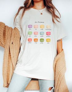 Macaron Tshirt, French Teacher Shirt, French Teacher Gift, Macaron Lover Shirt, France Tshirt, Pastry Shirt ❀ Design is printed directly onto the tshirt. ❀ More color options might be available upon request.  ❀ Size up if you want it oversized. ❀ The sizing is unisex. For garment measurements, please take a look at the size guide included in the listing images. Washing instructions: ❀ Wash inside out using mild detergent, on a low temperature setting.  ❀ Let hang dry (do not tumble dry). Shop Ho Small Business Design, Print Embroidery, French Teacher, Pattern Shirt, Teacher Shirts, Teacher Gift, Colorful Fashion, Business Design, Washing Instructions