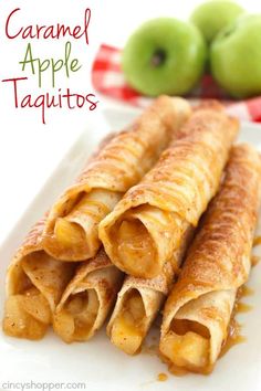 caramel apple taquitos on a plate with apples in the background