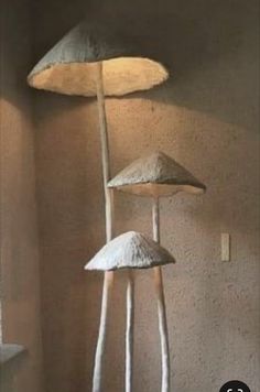 three mushroom lamps sitting next to each other