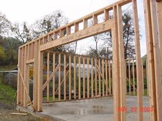 a wooden frame is in the process of being built for a house that's under construction