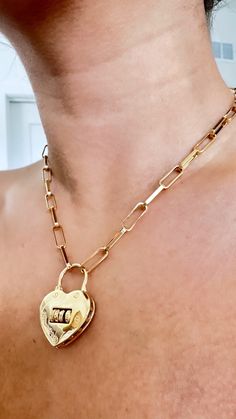 Paperclip Lock Chain Necklace, Necklace with Heart Lock Pendant, 18k Gold Filled, Trendy Paperclip Chain With Lock Charm, Chunky Paperclip Material: 14k Gold Filled high quality Necklace length: 16" + 2+ EXT (40 cm + 5cm) // 18" + 2" EXT (45 cm + 5 cm) Color: Gold Closure Chain: Lobster Claw **HOW TO CARE FOR YOUR JEWELRY *Maintain your jewelry's high shine by avoiding contact with any chemicals such as soap, perfume, lotion, makeup, hair & cleaning products. *When you do not use the jewelry you bought, you can always keep it in a pouch or box, reducing its contact with oxygen and wearing it for many years with its first day's shine. *You can do your product maintenance with a cotton-soft dry cloth. *You can always be stylish with the products you keep in the boxes sent to you. **PROCESSIN Gold Jewelry With Heart-shaped Lock, Heart-shaped Gold Jewelry With Lock, Chain Link Jewelry With Lock For Gift, Chain Link Jewelry With Lock As Gift, Heart-shaped Lock Necklace Gift, Lock Jewelry For Valentine's Day Gift, Heart-shaped Lock Jewelry For Valentine's Day, Valentine's Day Gift Jewelry With Lock, Lock Chain Necklace