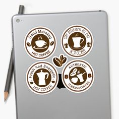 four coffee stickers on the side of a laptop