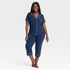 Add cool and comfy style to your everyday sleepwear collection with these Cloud-Knit Short-Sleeve Notch Collar Top and Cropped Pants Pajama Set from Auden™. Made from soft, stretchy fabric for a comfortable fit, this set includes a short-sleeve notch collar button-down top and cropped pants for a complete look. Plus, drawcord elastic waistband on the pants offers an adjustable fit. Wear the pieces as a set or mix and match with other PJs to put together a variety of sleepwear outfits. Auden™: Co Comfy Blue Sleepwear For Lounging, Blue Sleepwear Long Pants For Loungewear, Blue Long Pants Sleepwear For Loungewear, Comfortable Blue Sleepwear With Relaxed Fit, Cozy Short Sleeve Sleepwear, Casual Blue Sleepwear For Pajama Party, Casual Blue Sleepwear Pants, Cozy Short Sleeve Sleepwear For Relaxation, Cozy Blue Sleepwear For Loungewear