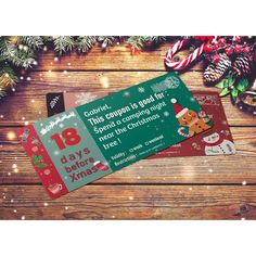 two christmas cards sitting on top of a wooden table