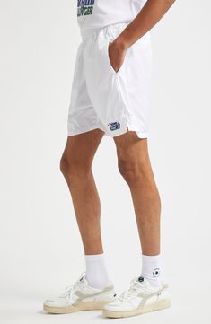 Serve your best style game on and off the court in these sporty tennis shorts equipped with side-seam pockets that hold three tennis balls each. This piece is part of a Nordstrom-exclusive capsule that pays tribute to two former tournament sites—Newport Casino and Forest Hills. Elastic waist Side-seam pockets 100% polyester Machine wash, line dry Made in Portugal Designer Clothing Summer Tennis Athletic Shorts, White Nylon Athletic Shorts With Built-in Shorts, Summer Athletic Tennis Shorts, White Tennis Shorts Athleisure, Athletic Shorts For Tennis, Spring, White Athleisure Tennis Shorts, Athleisure Athletic Shorts For Tennis In Summer, Short Athletic Shorts For Tennis, Spring, White Shorts For Tennis Athleisure