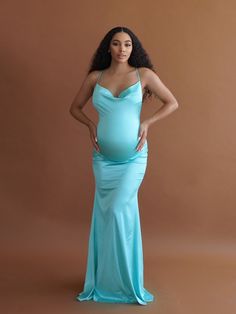 Our model is 5'7 wearing a Small Cassie has finally arrived with her draped bust line, Figure-hugging silhouette, and glamorous crossed-back spaghetti straps, she is guaranteed to have you looking & feeling like the belle of the ball. Perfect for a baby shower, pregnant wedding guest, or pregnancy photoshoot. The Cassie Gown is extremely soft stretch satin look fabric with adjustable crossed straps. Sleeveless Gown With Ruched Back For Prom, Bridesmaid Dress With Spaghetti Straps And Ruched Back, Gala Dresses With Crisscross Spaghetti Straps, Backless Prom Dress With Ruched Back And Spaghetti Straps, Backless Prom Dress With Built-in Bra, Spaghetti Strap Evening Dress With Ruched Back, Evening Dresses With Spaghetti Straps And Ruched Back, Pregnant Wedding Guest, Babymoon Outfits