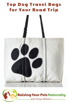 a white bag with black paw prints on it and the words top dog travel bags for your road trip