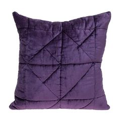 a purple pillow on a white background