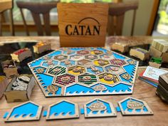 a wooden table topped with lots of different types of game pieces