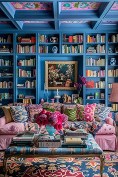 a living room filled with lots of colorful furniture and bookshelves full of books