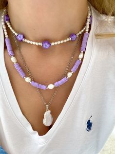 Three different boho summer necklaces with purple flowers, purple beads and freshwater pearls in different sizes and shapes. Combine them all together or wear them separetely as well. In Christina Christi Jewels store you can see more than 50 designs in Women's Necklaces. You can have them in 2-4 Days with DHL EXPRESS SHIPPING MATERIALS - Caoutchouc Beads. - Freshwater Pearls. - Stainless Steel Chain in Silver Color. - Metal Parts. - Adjustable Necklaces DIMENSIONS - Purple Flowers Necklace has Purple Jewelry With Colorful Beads For Beach, Elegant Purple Necklaces For Beach, Colorful Purple Beaded Necklace, Handmade Purple Beach Necklaces, Adjustable Purple Necklace With Colorful Beads, Necklaces Beach, Beaded Necklace Purple, Purple Beaded Necklace, Summer Necklaces