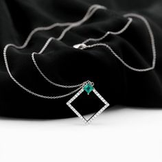 Product Details Enhance your jewelry collection with this exquisite Antique Diamond Emerald Pendant, featuring a stunning Solitaire Princess Cut Emerald as the centerpiece of the Open Square Design. Adorned with Round Brilliant Cut Diamond, this unique Womens Promise Pendant is crafted from Solid Gold, making it a luxurious addition to any outfit. Product Information SKU SHP-PENDANT032013897 Length 22 mm Width 21.6 mm Height 3 mm Weight 3.34 gm (Approximate) EMERALD INFORMATION No.of Stones 1 Pi Solitaire Princess Cut, Emerald Pendant, Square Pendant, Antique Diamond, Square Design, Round Brilliant Cut Diamond, Round Brilliant Cut, Princess Cut, Brilliant Cut Diamond