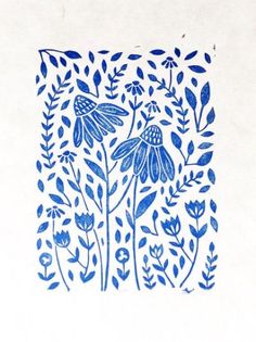 a drawing of blue flowers and leaves on white paper