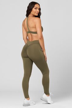 Our customer favorite! Experience style and comfort all in one with the V-Cut Scrunch Legging. Crafted with buttery-soft fabric and a V-cut waistband flatters your shape and hugs all your curves. The details: Buttery-soft fabric Butt Scrunch No front seam Quick-dry fabric V-cut waistband Hidden waistband pocket 4-Way stretch 75% nylon / 25% spandex Solid Ruched Activewear For Yoga, Stretch Ruched Activewear For Gym, Sporty Stretch Ruched Activewear, Fitted Ruched Activewear For Gym, Stretch Activewear With Ruched Back For Workout, Workout Activewear With Ruched Back And Stretch, Sporty Fitted Activewear With Ruched Back, Athleisure Ruched Workout Bottoms, Scrunch Leggings