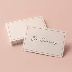 two white business cards with the word je sonds written on them, against a pink background