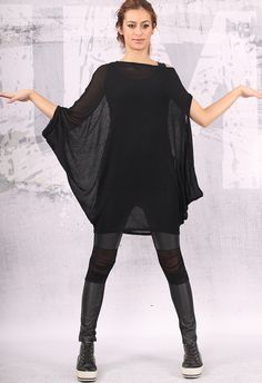 "Knit cotton asymmetrical black tunic with long sleeves. The length of the tunic is 37.5\" (95cm). If you prefer different length of the tunic or sleeves please inform me. I can make the tunic according to your size. I DO NOT CHARGE extra money for custom order. Material - 100% cotton. The fabric is knit cotton and it is sheer. The model on the picture is size M. Can be made in ALL SIZES. Enjoy this tunic and always be in a good mood! ALL GARMENTS IN THIS SHOP ARE MADE ACCORDING TO YOUR MEASUREM Tennis Skirt Outfit, Plus Size Tunic, Loose Tunic, Closet Inspiration, Loose Top, Black Tunic, Loose Blouse, Loose Tops, Looks Style