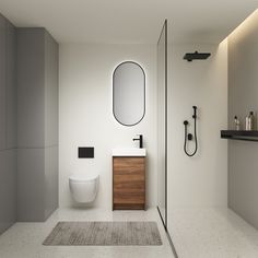 a bathroom with a sink, toilet and shower stall in it's own area