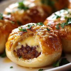 some food on a white plate with parmesan cheese and meat in the middle