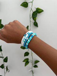 Cute blue and white bracelet set. made out of claybeads and seed beads. Blue Heishi Beads Bracelet With Tiny Beads, Blue Beaded Heishi Friendship Bracelets, Casual White Heishi Beads, Blue Heishi Beads Bracelets, Blue Heishi Beads Bracelet, Blue Tiny Beads Stretch Bracelet For Beach, Blue Heishi Beads Hand-strung Bracelets, Blue Heishi Beads Bracelets Hand-strung, Blue Stretch Bracelet With Tiny Beads For Beach