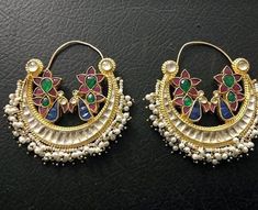 *It is Handmade Indian Ethnic Kundan Chandbali Earrings. *Its made from Silver and Copper with White Kundan Stones Settings with 22k gold Plating. *It gives Pure Ethnic Look with Antique Chandbali and 1.8 inch size. *Our all jewelry is made from semiprecious stones and beads. *WARRANTY: ITS GENUINE HANDMADE JEWELRY AND WE GIVE LONG LIFE WARRANTY FOR OUR ALL ITEMS. All of our Kundan Jewelry is 100% handmade with ancient Kundan stone setting method using silver foils. It is one of the most favorab Traditional Multicolor Chandbali Hoop Earrings, Multicolor Chandbali Earrings With Cutdana, Multicolor Chandbali Hoop Earrings For Weddings, Kundan Chandbalis With Peacock Design, Traditional Chandbali Bridal Earrings With Peacock Design, Multicolor Cutdana Chandbali Bridal Earrings, Traditional Bridal Chandbali Earrings With Peacock Design, Meenakari Hoop Earrings For Celebrations In Temple Jewelry Style, Traditional Kundan Hoop Earrings With Meenakari