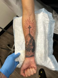 Jesus forearm tattoo cross tattoo Back Forearm Tattoo Men Ideas, Religious Forearm Tattoo, Biblical Sleeve Tattoos, Christian Tattoos For Men Sleeve, Creative Christian Tattoos, Cross Forearm Tattoo Men, Forearm Cross Tattoos For Women, Forearm Cross Tattoo Men, 3 Crosses Tattoo Men