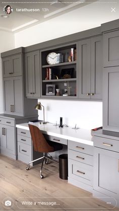 a home office with gray cabinets and white counter tops is featured in this image from the website