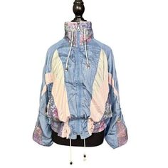 Good Vintage Condition - Regular Wear Consistent with Age Embrace the retro vibes with this vintage 90s windbreaker jacket, featuring a stylish colorblock design in pastel shades of blue, pink, and cream. This medium-sized jacket is perfect for those who love to add a touch of nostalgia to their wardrobe. The lightweight fabric and drawstring details make it an ideal choice for breezy days and outdoor adventures. - Size: Medium - Color: Blue with pink and cream accents - Material: Lightweight ny Pink Windbreaker, 90s Windbreaker, 90s Retro, Pastel Shades, Spring Jackets, Patchwork Designs, Lightweight Jacket, Windbreaker Jacket, Outdoor Adventures