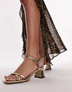 Topshop Iona strappy block heeled sandal in gold lizard | ASOS Gold Ankle Strap Block Heels For Spring, Gold Block Heels With Ankle Strap For Spring, Gold Block Heels With Heel Strap For Spring, Gold Sandals With Block Heel, Gold Block Heels With Buckle Closure, Gold High Heel Block Heels With Buckle Closure, Gold Sandals With Heel Strap And Block Heel, Gold Block Heels With Buckle Closure For Summer, Gold Ankle Strap Heels With Buckle Closure