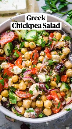 greek chickpea salad in a white bowl