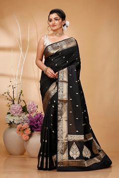 Elevate your ethnic wardrobe with this Exquisite Handwoven Banarasi Saree, a masterpiece of traditional Indian craftsmanship. Made from premium quality silk, this saree features intricate Zari work that showcases the rich cultural heritage of Banaras. Perfect for weddings, festivals, and special occasions, this Banarasi saree exudes elegance and sophistication. Each saree is meticulously handcrafted by skilled artisans, ensuring that every piece is unique and of the highest quality. The luxuriou Ceremonial Cotton Silk Zari Traditional Wear, Ceremonial Cotton Silk Traditional Wear With Zari Work, Ceremonial Cotton Silk Traditional Wear With Cutdana, Transitional Paithani Silk Traditional Wear With Zari Weaving, Ceremonial Katan Silk Traditional Wear With Zari Weaving, Ceremonial Katan Silk Saree For Diwali, Ceremonial Banarasi Silk Saree With Pallu, Black Banarasi Silk Traditional Wear For Ceremonial Occasions, Transitional Traditional Wear With Zari Weaving In Banarasi Silk