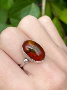 Vintage sterling silver ring with Baltic amber, UK size L 1/2, US 6. Stone size 17mm x 12mm. Amber Cabochon Ring For Anniversary, Oval Cabochon Ring With Natural Inclusions For Gift, Classic Amber Rings For Gifts, Oval Amber Hallmarked Rings, Formal Amber Oval Cabochon Rings, Classic Sterling Silver Ring With Oval Cabochon, Classic Amber Ring Jewelry, Classic Handmade Opal Ring, Classic Amber Ring With Polished Finish