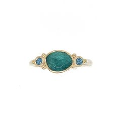 Originally discovered in Madagascar this unique stone is gaining in popularity due to its scarcity and its stunning coloring. Set in 14k yellow gold with a handmade sterling silver seagrass band we accented it with glowing blue zircons. Approximate stone size: 8mm x 6mm Approx TCW: 1.5cts Mohs hardness: 7.5 This one of a kind piece is handmade with love in Emily's Hudson Valley studio. If you have questions about sizing, shipping or need help deciding please reach out to us! Blue Zircon Ring, Colored Stone Engagement Rings, Stacked Engagement Ring, Coloring Set, Local Jewelry, Zircon Ring, Stone Engagement Rings, Diamond Shop, Stone Engagement