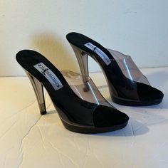 In Very Good Condition Has Small Scratche ( Look At The Picture) Does Not Affect The Beautiful Appearance Of The Shoe. In New Condition Never Worn About Me: I Accept Reasonable Offers. Same Or Next Day Shipping. Classic Black Sandals For Party, Black Slip-on Heels For Night Out, Sleek Black Slip-on Heels, Black Open Toe Heels With Translucent Outsole, Black Heels With Translucent Outsole For Party, Chic Black Sandals With Translucent Outsole, Formal Synthetic Heels With Translucent Outsole, Classic Black Heels For Party, Classic Black Party Heels