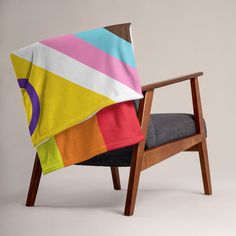 a chair with a colorful blanket on it