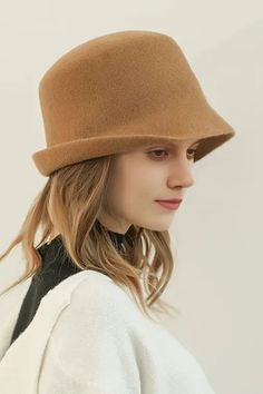 Classic Elegance Meets Modern Comfort in Wool Felt Hat This 100% woolen ladies' hat is an autumn-winter staple, offering exceptional warmth with a touch of sophistication. Featuring a flat crown with a stylish upturned brim, it merges modern fashion with classic aesthetics. Crafted from pure sheep's wool, it provides a comfortable, breathable fit while ensuring excellent insulation. Whether for daily wear or as a statement piece, this cloche hat enhances facial contours, while its cloche hat sty Classic Cloche Hat With Curved Brim For Fall, Classic Fall Cloche Hat With Curved Brim, Beige Cloche Hat With Curved Brim For Fall, Beige Brimmed Felt Hat For Winter, Beige Felt Hat With Short Brim For Winter, Beige Short Brim Felt Hat For Winter, Beige Wool Felt Hat For Fall, Winter Fedora With Short Brim In Fur Felt, Classic Solid Cloche Hat For Fall