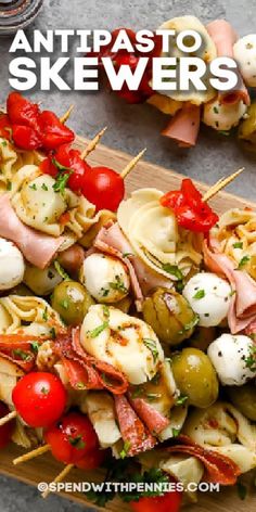 several skewers filled with meat, vegetables and sauces on top of a cutting board