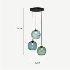 three glass globes hanging from the ceiling with measurements for each bulb and one light fixture