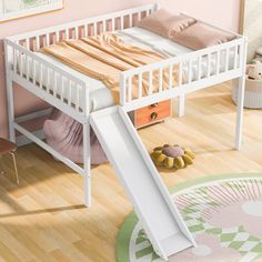 a child's bed with a slide underneath it