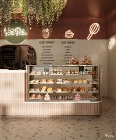 the interior of a bakery with baked goods on display