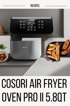 an air fryer is on the counter next to some food